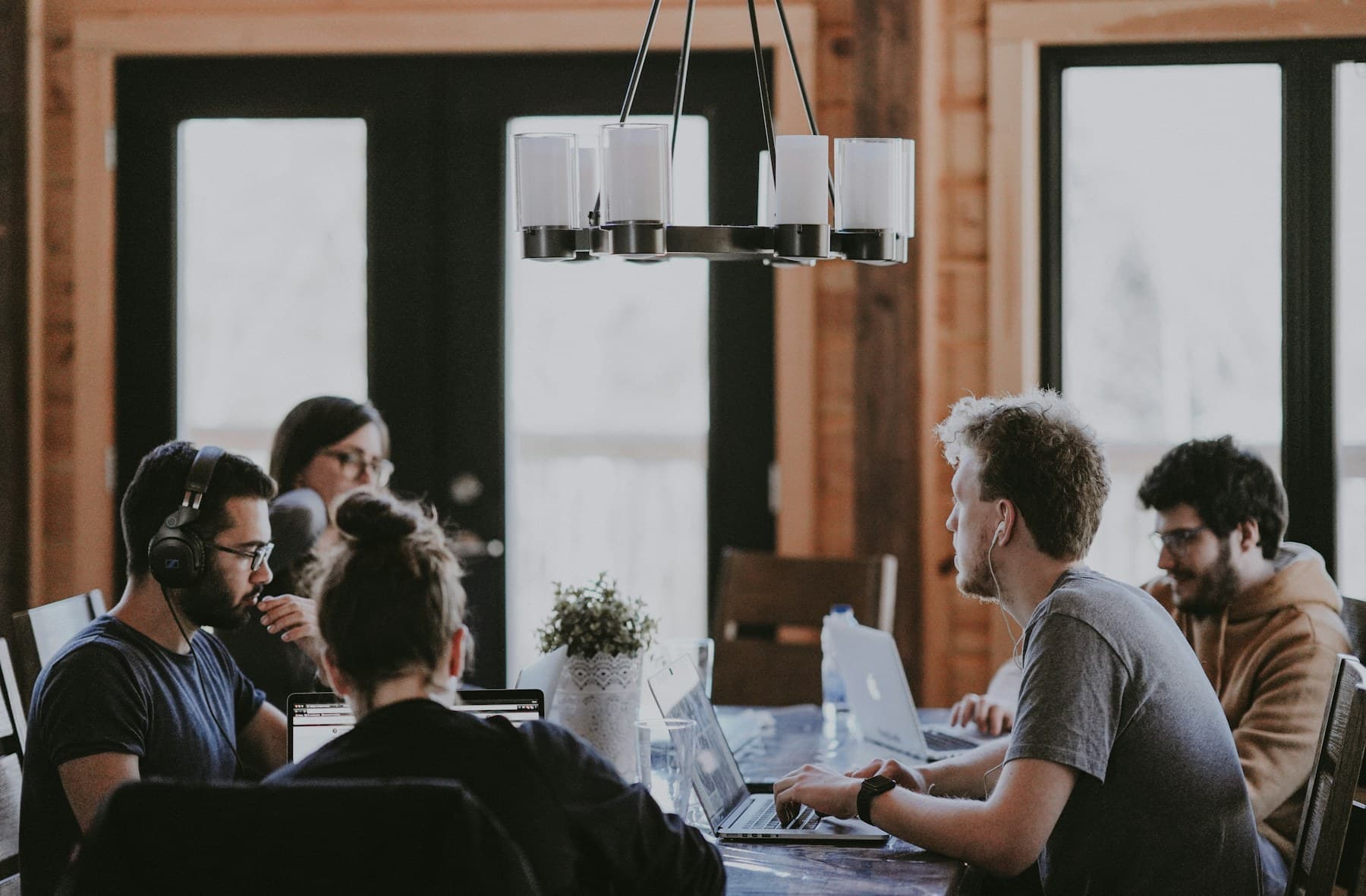 A team sharing information together in a controlled workspace