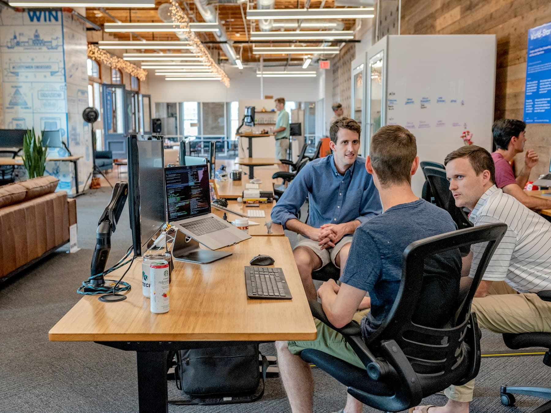 A team reviewing project changes together around a table